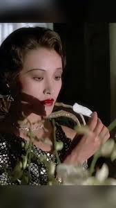 In "The Last Emperor," one of the film's most haunting scenes features  Empress Wan Rong (played by Joan Chen) sitting alone in a corner, quietly  eating flowers while a jubilant waltz plays in the ...