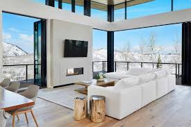 A super easy small living room tv idea is just to paint the wall the tv is mounted on in a dark shade. 30 Modern Living Rooms With Fireplace And Tv Together Decor Snob