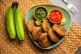 Raw Banana Cutlet also called plantain or kacche kele ki tikki or patties,  served with chutney 15933460 Stock Photo at Vecteezy