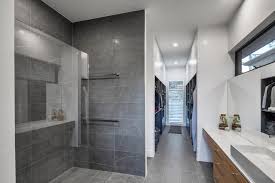 Pocket doors were installed between the spaces to create separation. Walk In Wardrobe Precision Homes