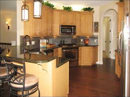 Honey oak light brown kitchen cabinets with white countertops. Honey Oak Kitchen Cabinets With Dark Wood Floors Novocom Top