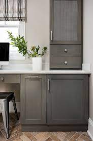 The key to using this stunning style is to strive for a balance between the two finishes. The Cabinets Are Maple And Finished In A Weathered Grey Stain Gray Stained Cabinets Staining Cabinets Stained Kitchen Cabinets