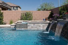 With Waterfall Yosemite Stone Look Tile Jules Mocha Blend Glass 1 Swimming Pool Installation Backyard Pool Designs Pool Finishes