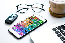 White Iphone On Table Next To Macbook Laptop Mockup White Iphone Macbook Laptop Macbook