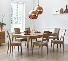 A Beautiful Contemporary Style In Pale Oak The Ercol Romana Modern Dining Collection Has The Warmt Oak Dining Chairs Extendable Dining Table Oak Dining Table