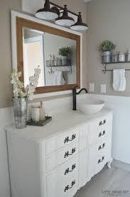 16 Bathrooms That Rock The Farmhouse Style Farmhouse Master Bathroom Bathroom Furniture Vintage Bathroom Cabinet