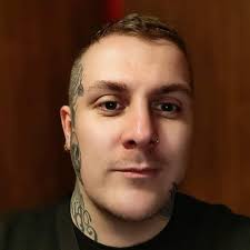 Theres a calling card with 2 mermaids either side an like a moon in the  middle with a gun seen it once or twice i want it an dont know how to