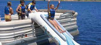 Surfing and boarding there are beach equipment rentals aplenty for those who want to hang 10 in the gulf or skim the waves on a boogie board. Rave Pontoon Slide Commercial Recreation Specialists