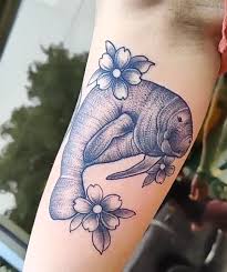 Manatees by brea lanyon at alchemy tattoos in hawthorn, vic, australia. Manatee And Flowers By Drew Potts Tattoonow
