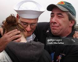 Colleen Mathias welcomes home her husband Petty Officer Mike Mathias...  News Photo