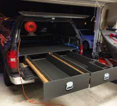 This hard case creates usable space behind the wheel well for up to 75 pounds of equipment, and it swings out almost 180 degrees when needed for added accessibility. 50 Truck Bed Drawers Ideas Truck Bed Truck Bed Storage Truck Bed Drawers