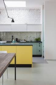 The vaulted ceiling adds a rustic feel to space while the large beige furniture is modern style. Best 60 Modern Kitchen Brick Backsplashes Design Photos And Ideas Dwell