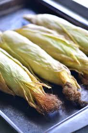 Drizzle with enough olive oil to lightly coat the corn. Oven Roasted Corn On The Cob With The Husks The Gunny Sack