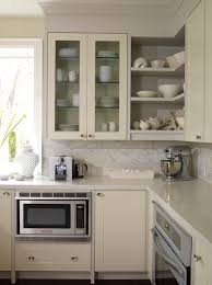It is a little unexpected, but still a solid neutral that works with everything from modern gold accents to farmhouse style. Kitchen With Cream Cabinets Contemporary Kitchen Ici Dulux French White Sarah Richardson Design