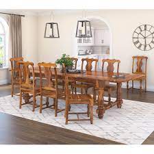This table couldn't reel back its rustic charm even if it tried! Oroville Farmhouse Solid Wood Extendable Dining Table Set For 8 Person
