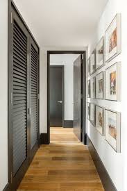 White Gallery Wall Hallway With Black Trim Hallway Designs Diy Interior Doors Black Interior Doors