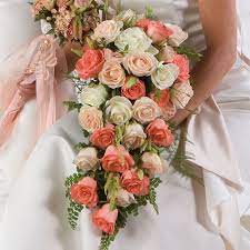 Handmade roses in peachy shades of coral & champagne. Pin By Delia Jackson On The Dream Cascading Bridal Bouquets Bridal Bouquet Flowers Bridal Bouquet