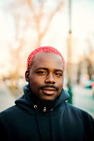 Whether you color your whole hair pink or just throw in highlights, experiment to these 11 pink hairstyles for men will prove why you need to give it another thought! Hd Wallpaper Man Standing While Looking Sideway Shallow Focus Photography Of Smiling Man In Black Pullover Hoodie Wallpaper Flare