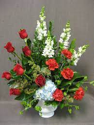 Maybe you would like to learn more about one of these? Funeral Flowers In Red White And Blue Funeralflowers Funeral Floral Funeral Floral Arrangements Flower Arrangements