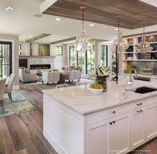 An open floor plan (kitchen, living room, dining room) is one of the most popular house layouts today. Love This Open Floorplan And The White Kitchen And Big Island Open Plan Kitchen Living Room Open Concept Kitchen Living Room Kitchen Concepts