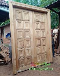 Jual kusen pintu jepara terlengkap desain ukir ukiran, minimalis, mewah, klasik terbaru kayu jati & mahogany pilihan grade a perhutani bisa custom model single double 2 daun kupu tarung untuk pintu utama depan serta kamar tidur gratis biaya pengiriman seluruh indonesia Pintu Jati Minimalis Kotak Kotak Model Terbaru Kusen Pintu