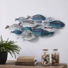 Set it all off with simple furnishings, like a slim coffee table fashioned from reclaimed wood. Danya B Coastal School Of Fish Metal Wall Art Fhb6563 The Home Depot
