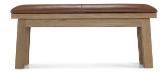 Knotty nutmeg finish on asian hardwood construction gives this dining collection a rustic country feel with modern touches. Holloway Rough Sawn Oak Dining Bench Quercus Living