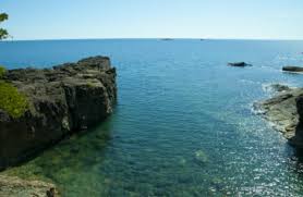 To get there, park in the small lot located just off peter white drive and follow a narrow foot path that leads directly into the cove. Black Rocks Upper Peninsula Wiki Fandom