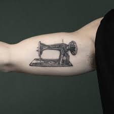 Beautiful half sleeve tattoo showing off a dress and a sewing machine! Little Singer Sewing Machine