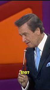 Bob Barker messes around with announcer Johnny Olson