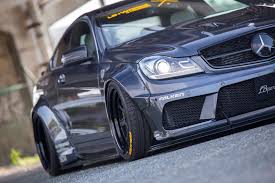 Mercedes Amg C63 Coupe And Sedan Graduate From The Liberty Walk Academy Carscoops Mercedes C63 Amg Mercedes Benz C63 Mercedes Amg