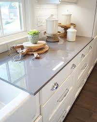 There S Just Something About A Bright Kitchen With White Cabinets And Gray Countertops That So Kitchen Cabinet Design Gray Kitchen Countertops Grey Countertops