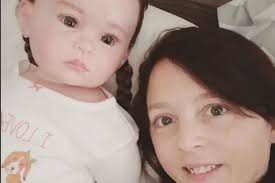 Woman treats doll like real baby to numb pain of not being able to have  children