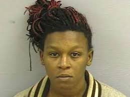 Woman charged in boy's beating death