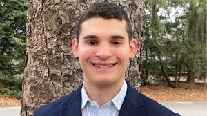 Naila Smith walks up to recieve her check from Palm Beach County  Commissioner Bobby Powell.