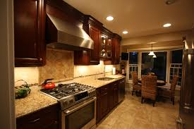 wide galley kitchen cherry cabinets