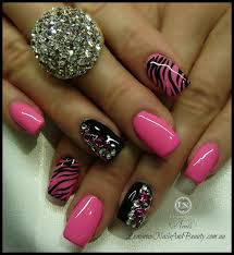 The leopard prints are further painted in silver glitter polish and outlined by black polish too stand out. 20 Pretty Nail Designs For This New Season Pretty Designs Crystal Nails Nails Zebra Nails