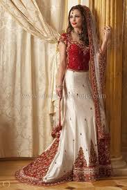 Indian Bridal Dresses White Raw Silk Classic Bridal Lengha With A Rusty Red Blouse And White Indian Wedding Dress Asian Wedding Outfits Latest Bridal Dresses