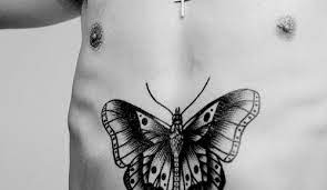 The Butterfly On His Torso Is Based On An Old French Prison Tattoo Inspired By Papillon Traditiona Harry Styles Shirtless Harry Edward Styles Prison Tattoos