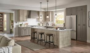A darker finish gives the cabinets a more streamlined look, which can capture a more urban, industrial sensibility. New Medallion At Menards Cabinets