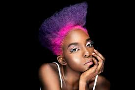 As a man with long hair, you might consider getting a color combination between green, pink and purple highlights and you don't necessarily need to use permanent hair dye. Portrait Of Eccentric Young Woman With Pink And Purple Dyed Hair In Front Of Black Background Stockphoto