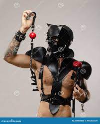 A Man in a Bdsm Mask of a Skull Demon with a Gag, Dressed in a Leather  Cloak with Leather Bracelets and Straps on the Stock Image - Image of lgbt,  pleasures: