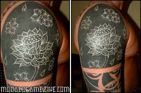 Tattoo artists all over the world surely have at least one flower tattoo design available because of white ink tattoos are generally more expensive than the regular black ink tattoos. Black Tattoo Cover Up With White Ink Tattoo Designs Ideas