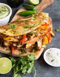 The best way to reheat it and still keep the outside crispy is to use a non stick pan over medium heat. The Best Chicken Quesadilla Recipe Don T Go Bacon My Heart