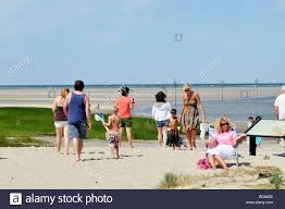 People Walking In Sand At Rock Harbor Beach In Orleans Cape