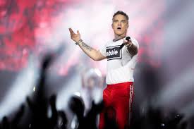 Robbie Williams follows in Ryan Reynolds’ footsteps and pumps cash into EFL club
