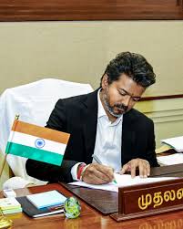 Tamilaga Vettri Kazhagam (TVK) chief Vijay has officially taken oath as the new Chief Minister of Tamil Nadu. After five intense days, four meetings with the Governor, and continuous negotiations with alliance