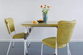 They also have nice vinyl options for the chairs. Vintage Yellow Atomic Patterned Formica Kitchen Table And Two Chairs By Steelux Of London England Vinterior