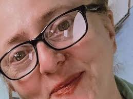 Terrible moment bus driver hits and kills a pedestrian as she crosses the  road while he is distracted by reading a piece of paper