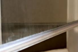 How To Clean The Plastic Strip At The Bottom Of A Glass Shower Door Glass Shower Doors Shower Door Seal Shower Doors